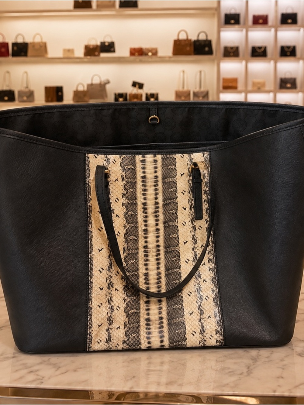 Michael Kors Saffiano leather paired in anaconda or python-print center